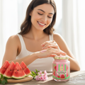 Glowing woman applying Watermelon Shea Butter on a sunny day